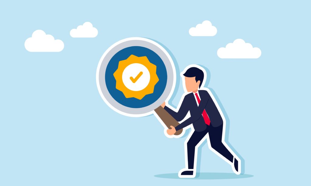 Businessman holding a magnifying glass with a verification check mark